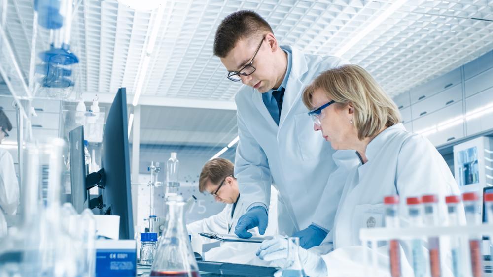505(b)(II) for New Drug Application male and female scientist looking at computer data